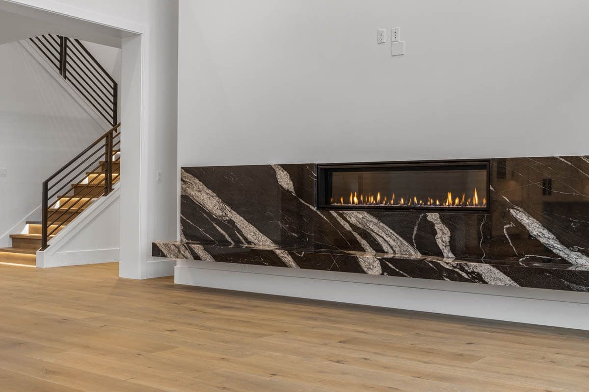 Fireplace and great room by Home Plans NW